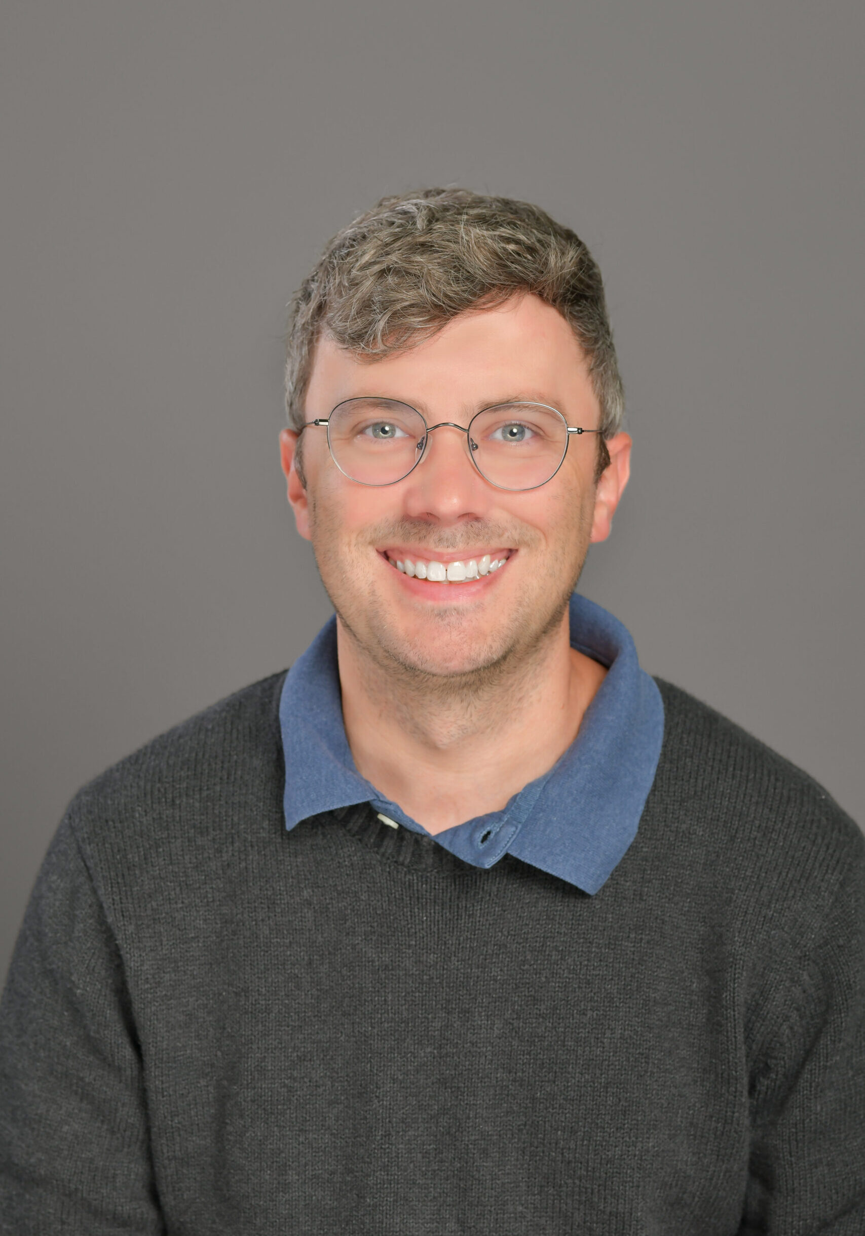 Smiling man with glasses